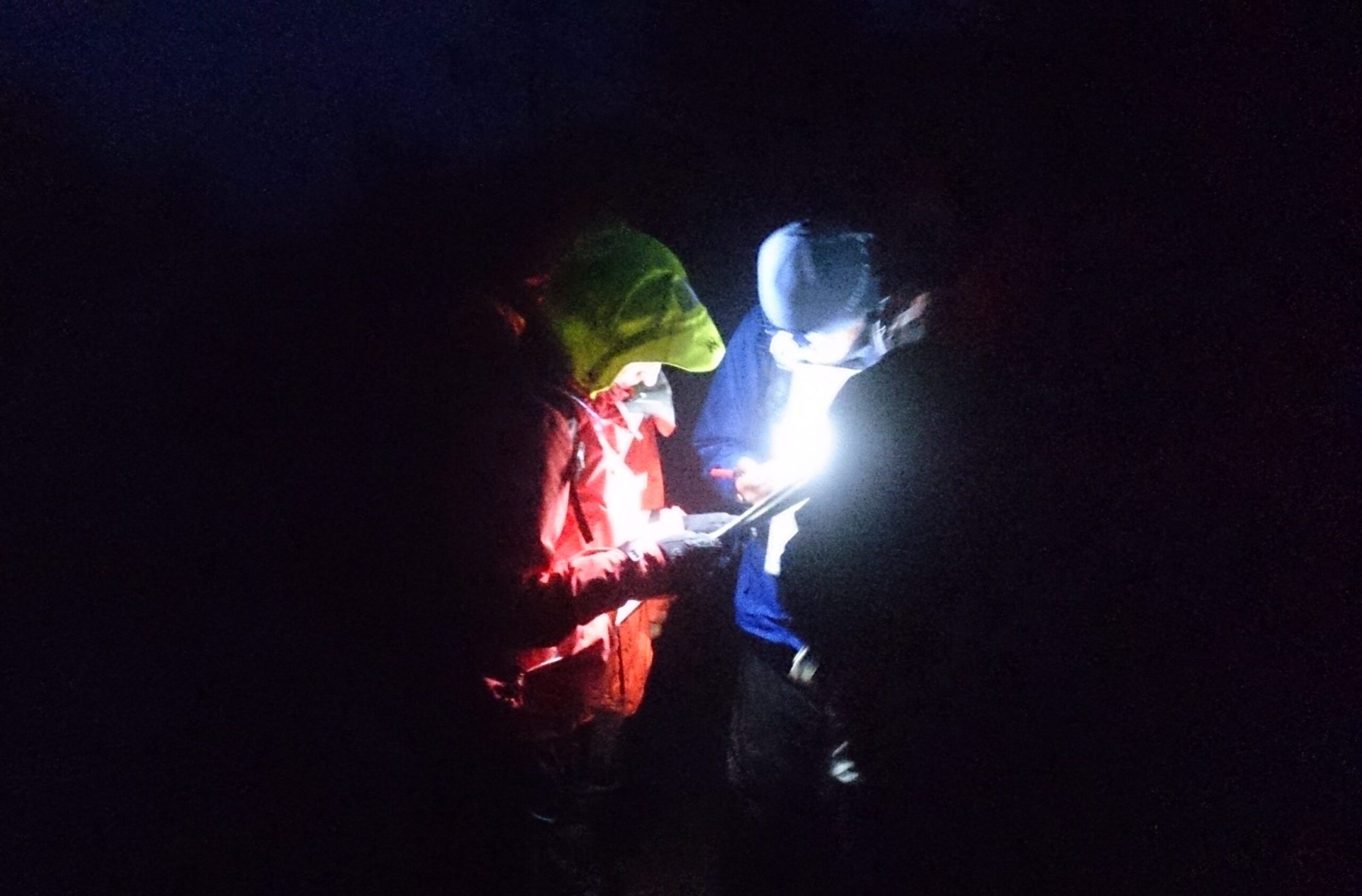 Night navigation with mountaintrails a person sitting in a dark room
