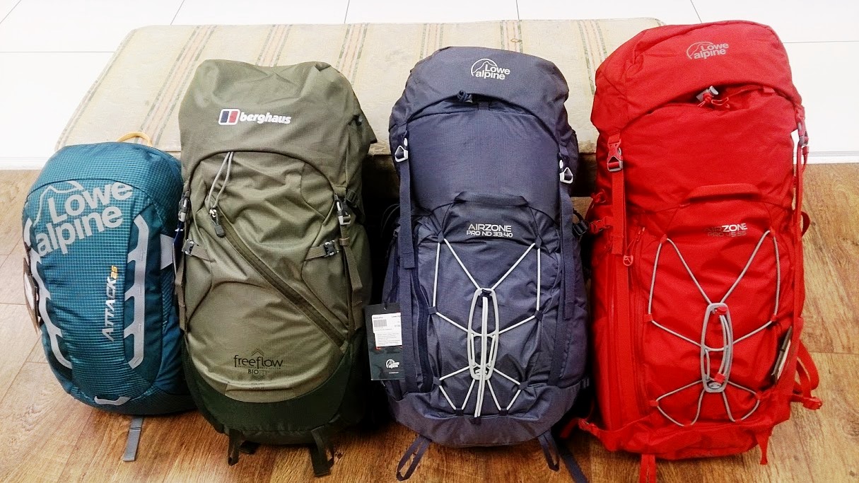 a pile of luggage sitting on top of a suitcase