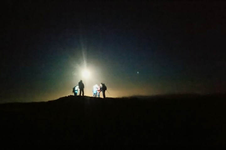 a person standing in a dark sky