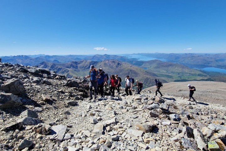 a group of people on a rocky hill