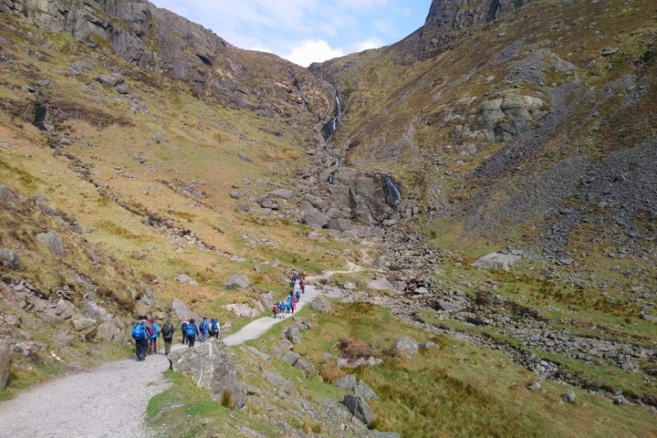 a group of people on a rocky hill